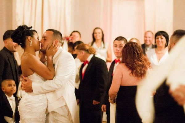 People kissing at their wedding after discussing The Importance of Wedding Photography And Videography