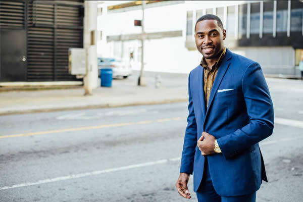 Man in a blue business suit.