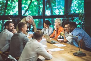 9 people working on a Google Business Profile during a meeting in a digital marketing agency