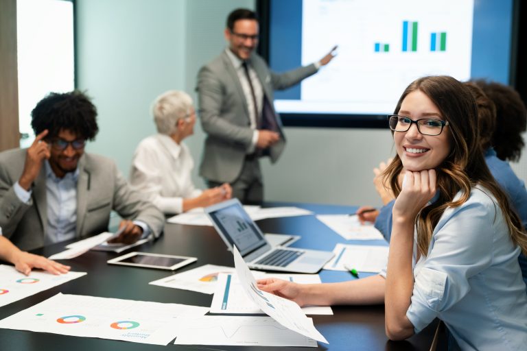 A google business profile manager smiling during a meeting in a digital marketing agency